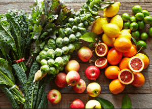 a group of fruits and vegetables on a wood surface Healthy Weight Loss Diets Bridgend